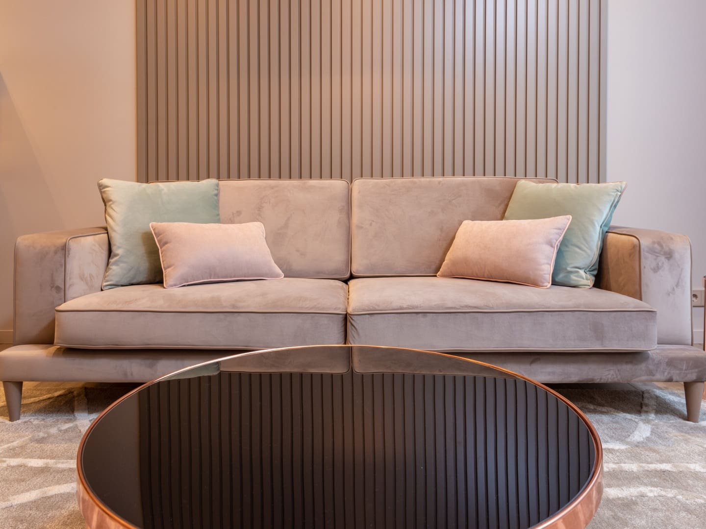 A living room with a couch and coffee table