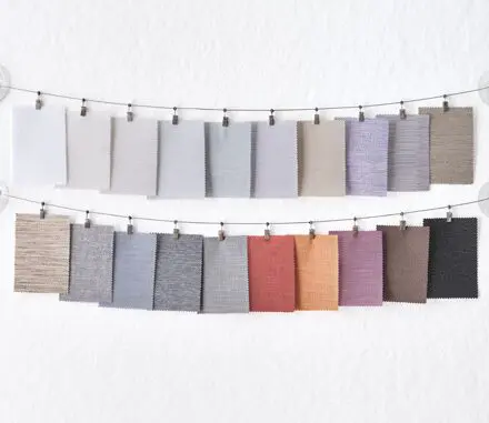 A row of color swatches hanging on a line.